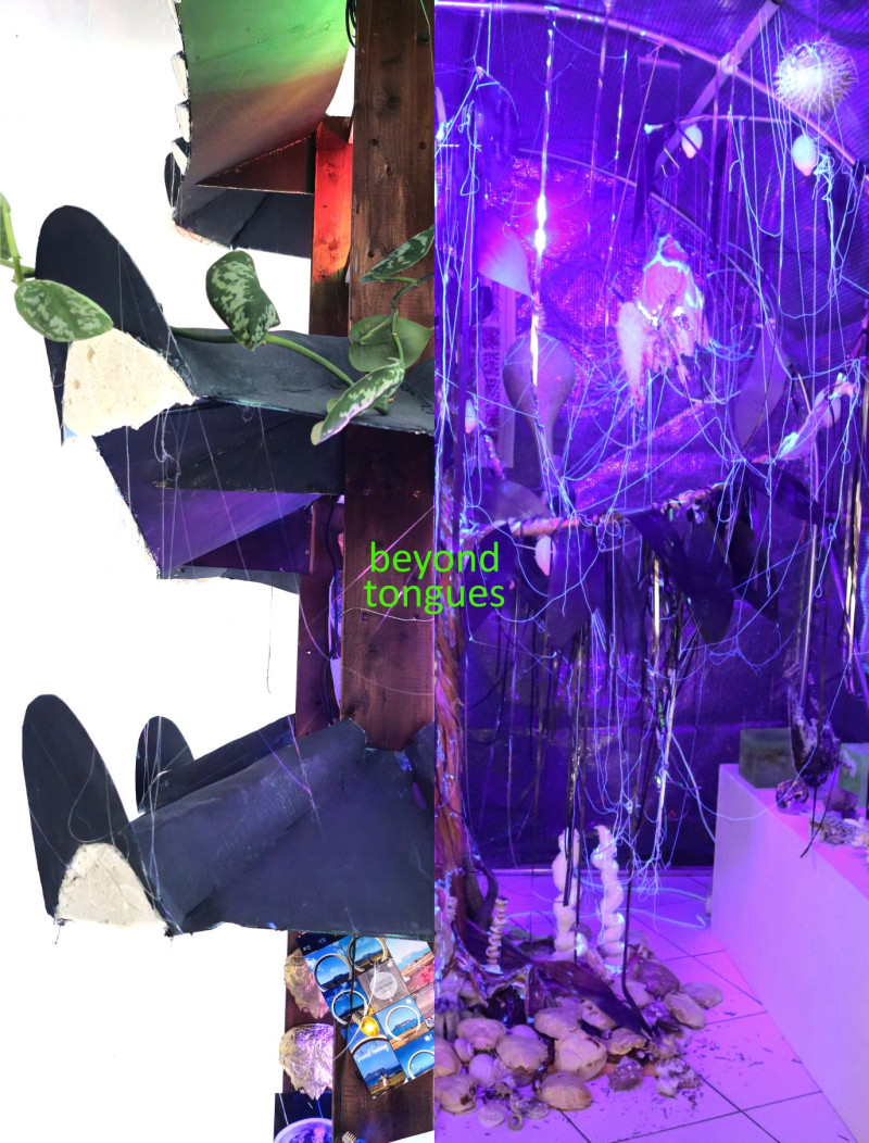 One side of the picture is in purple with various elements such as stones. The other side of the picture shows sculptural abstract elements.