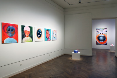 Room view. Colourful images with emotional images hang on the walls