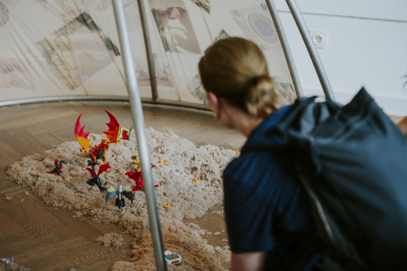 A visitor kneels in front of Isabella Fürnkäs’ 
