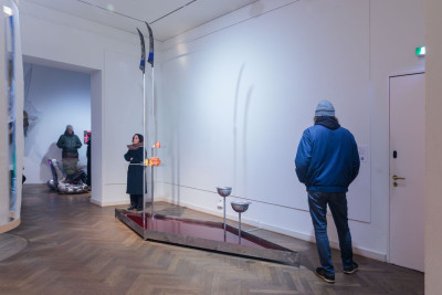 Installation view of the Neuköllner Kunstpreis 2026 featuring people and the work 